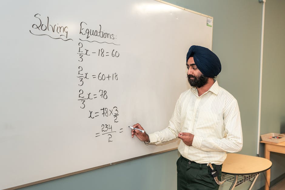 Image of a mathematician working on complex math problems